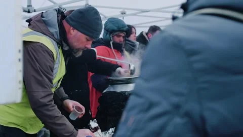 11 March, 2022 - Lviv, Ukraine: Volunteers feed refugees from eastern Ukraine at Stock Footage