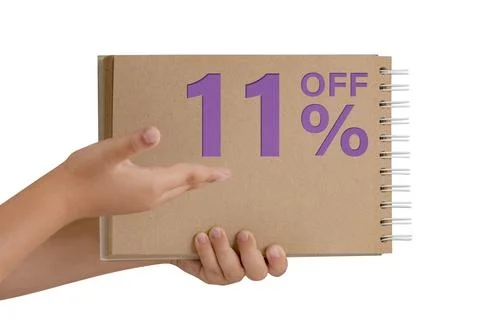 11 percent discount on isolate. Notepad from recycled paper in the hands of a Stock Photos