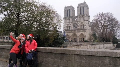 11 Rainy gray winter day Paris glad female tourists taking selfie picture on  Stock Footage 100814504