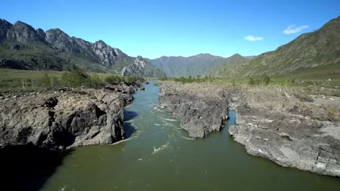 11 river in the mountains, steep and rocky shore, early spring in the mounta Stock-Footage 264103773