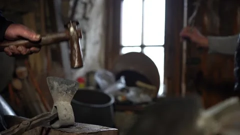 1/10 Blacksmith Forging Hits Metal Iron with Hummer In Workshop Stock Footage 233995393