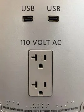 110 Volt AC Electrical Outlet with USB ports nearby. 写真素材