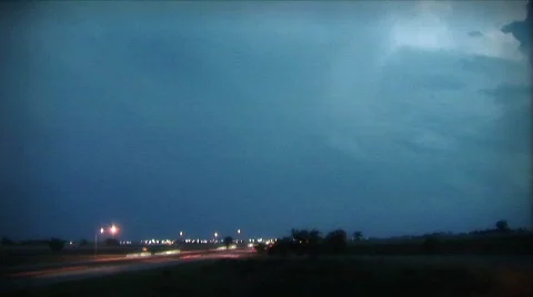 (1105) Time Lapse Summer Thunderstorm and Lightning with Traffic and City Lights Stock Footage 483672