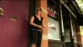 (1112) Tattooed young woman with Mohawk in front of Tattoo Parlor HD Footage