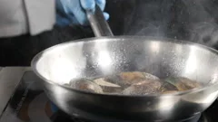 Splendid slow motion food video. chef cooking or tosses seafood in frying pan