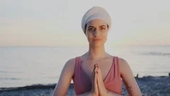 Close-up. Female yoga teacher or guru perform gesture of greeting and regard