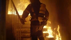 Brave Firefighter Runs Up The Stairs. In Slow Motion. Raging Fire Everywhere.