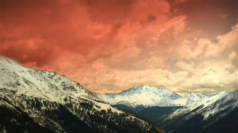 (1151) Early Early Colorado Winter Mountains Snow Sunset Clouds Skiing LOOP! Stock Footage