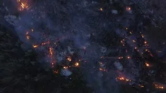 Amazon rainforest fire overhead aerial shot. Drone view glow and flames