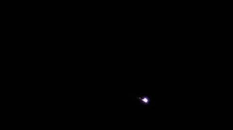 116 Helicopter on Night Patrol Shines Search Light Directly to Camera Stock Footage