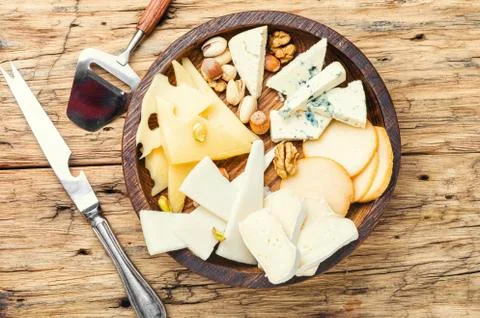Cheese  on  the  table.various  types  of  cheese  on  old  rustic  wooden  table xkwx different,  cheese,  piece,  nut,  kinds,  assorted,  slice,  snack,  healthy,  cutting,  appetizer,  delicatessen,  product,  fresh,  cut,  parmesan,  tasty,  italian,  cheddar,  meal,  food,  brie,  swiss,  breakfast,  assortment,  milk,  hole,  eating,  dairy,  part,  portion,  holland,  knife,  set,  dinner,  tray,  plate,  cheese  board,  cheese  platter,  flavor,  sliced,  piece  cheese,  wooden,  wooden  table