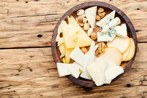 Cheese  on  the  table.various  types  of  cheese  on  old  rustic  wooden  table xkwx different,  cheese,  piece,  slice,  kinds,  snack,  assorted,  sliced,  cutting,  appetizer,  delicatessen,  product,  delicious,  fresh,  cut,  parmesan,  tasty,  italian,  cheddar,  meal,  food,  brie,  swiss,  breakfast,  assortment,  milk,  hole,  eating,  dairy,  part,  portion,  holland,  triangle,  set,  dinner,  tray,  plate,  cheese  board,  cheese  platter,  piece  cheese,  wooden,  wooden  table,  copy  space,  space