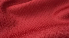 Close up detailed cloth texture of shiny spandex cloth with dolly shot.