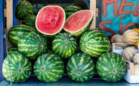 Watermelons  on  shelf.  Cutted  watermelon  on  street  market.  Summer  Fruits. xkwx watermelon,  supermarket,  fruit,  farm,  melon,  shop,  bazar,  fruits,  retail,  marketplace,  fresh,  market,  food,  shelf,  organic,  background,  store,  red,  diet,  freshness,  ripe,  sweet,  nutrition,  natural,  summer,  juicy,  grocery,  raw,  water,  delicious