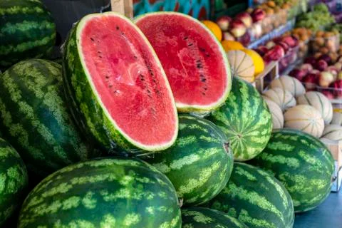 Watermelons  on  shelf.  Cutted  watermelon  on  street  market.  Summer  Fruits. xkwx watermelon,  supermarket,  fruit,  farm,  melon,  shop,  bazar,  fruits,  retail,  marketplace,  fresh,  market,  food,  shelf,  organic,  background,  store,  red,  diet,  freshness,  ripe,  sweet,  nutrition,  natural,  summer,  juicy,  grocery,  raw,  water,  delicious