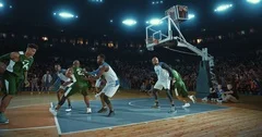 Basketball players on big professional arena during the game