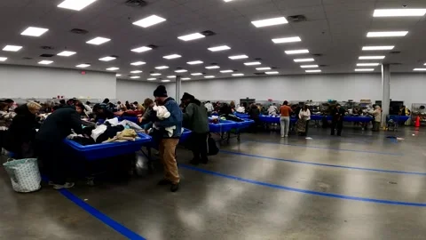12-30-2025: Hackensack, NJ, USA: Race to get a good deal at Goodwill bins Stock Footage 325348454