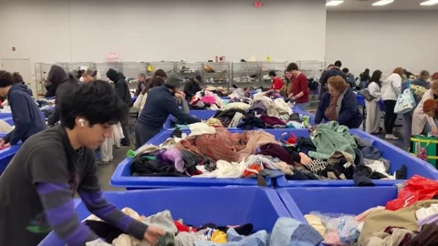 12-30-2025: Hackensack, NJ, USA: Thrifters and resellers at Goodwill bins Stock Footage 325348690