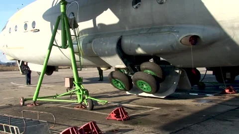 An-12 aircraft (NATO - Cube). Control check of operability of landing gear. Stock Footage 171572339