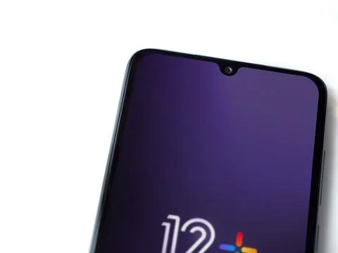 12+ app launch screen on smartphone on white background Stock Photos