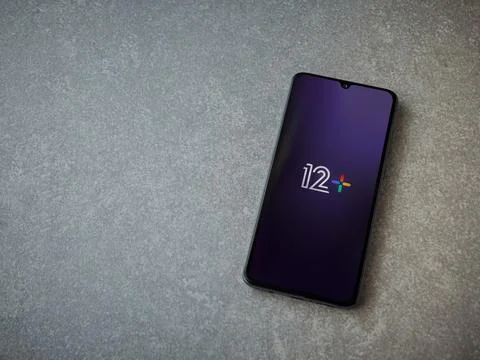 12+ app launch screen on smartphone on ceramic stone background Stock Photos