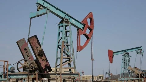 1/2 Azerbaijan Working Oil Pumps Silhouette In the field Stock Footage 203834412