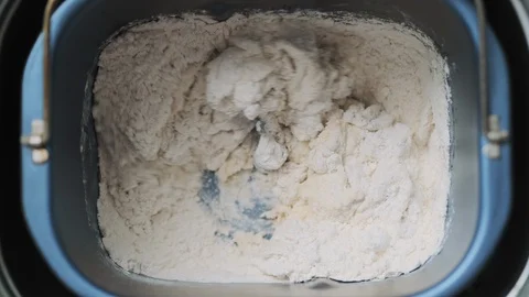 12 Domestic Bread Machine Making Dough With Ingredients At Home Stock Footage 128699339