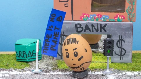 12 fps Stop motion of a hood vandal egg makes graffiti on a bank Stock Footage 89490674
