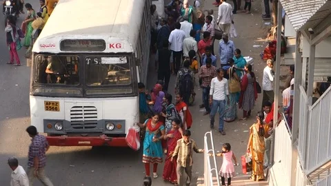 12-High-Angle-View-people-board-city-bus-in-busy-street Stock Footage 89420532