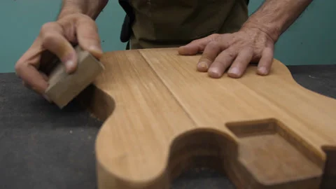 12 seconds video in Full Hd with horizontal slider motion of luthier's hand.. Stock Footage 236718013