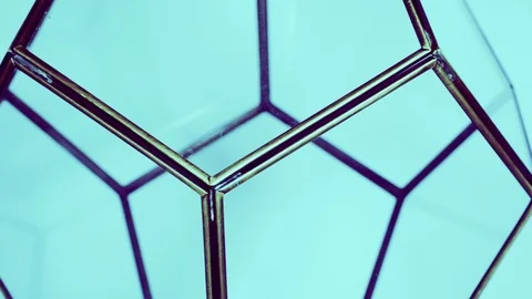12 sided glass geometric shape rotating on blue background Stock Footage 96548685
