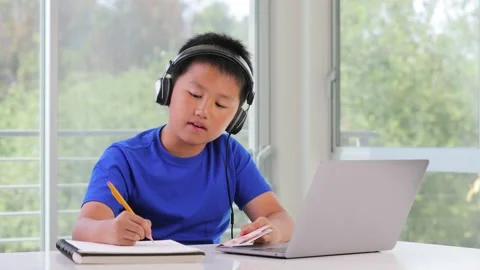 12 year old boy keeping track of his allowance Video stock 255626230