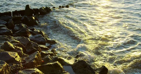120 fps slow motion shot of water hitting rocks in Branford, Connecticut. Stock Footage 73330961