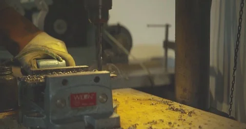 120 fps slow motion shot of worker using industrial drill at a metal shop. Stock Footage 73334290