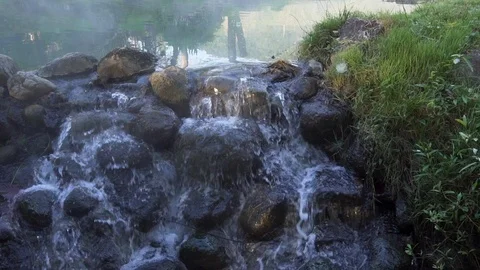 120 FPS of a waterfall from a Hot Steam pond with steam rising at Chaeson Stock Footage 100814059