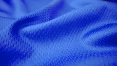 Close up detailed cloth texture of shiny spandex lycra cloth flowing with