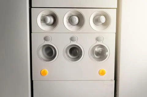 Adjustable  lights  and  air  conditioners  overhead  seat  controls  of  a  commercial  aircraft.  Closed  air  conditioners  nozzles xkwx airplane,  knob,  passenger  cabin,  control  panel,  air  vehicle,  control,  technology,  flying,  push  button,  travel,  airplane  seat,  seat,  transportation,  sign,  symbol,  design,  safety,  equipment,  commercial  airplane,  passenger,  airplane  interior,  airline,  ceiling,  aeroplane,  console,  ventilation,  conditioning,  conditioner,  board,  fly,  aircraft,  panel,  button,  cabin,  flight,  overhead,  plane,  nozzles,  closed,  round,  adjustable,  icon,  light,  transport,  seating,  nobody,  security,  plastic