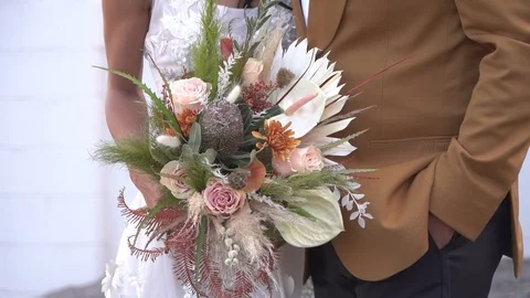 120fps Slow Motion Bride and Groom Holding Bouquet Flowers Stock Footage 121010058