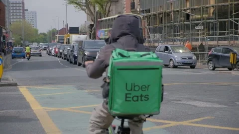 120fps. Uber eats. Food delivery service, man on bike. Hull.06.05.2024 Stock Footage 274932657