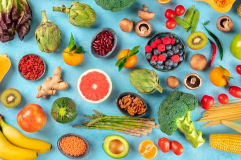 Vegan  food.  Healthy  diet  concept.  Fruits,  vegetables,  pasta,  nuts,  legumes,  mushrooms,  shot  from  above  on  a  blue  background.  A  flat  lay  composition xkwx vegan,  vegetarian,  food,  healthy,  diet,  background,  fruit,  vegetable,  pasta,  mushrooms,  legumes,  pulses,  overhead,  above,  view,  top,  shot,  flat,  lay,  flat  lay,  flatlay,  nuts,  table,  cooking,  kitchen,  raw,  fresh,  nutrition,  ingredient,  concept,  veg,  produce,  supermarket,  organic,  vitamin,  protein,  carbohydrate,  fiber,  wholesome,  natural,  superfood,  grapefruit,  artichoke,  broccoli,  various,  variety,  assortment,  many,  different,  blue