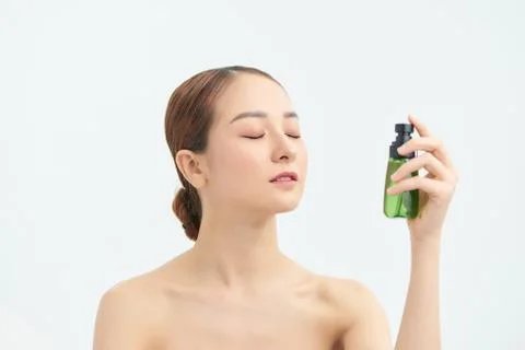 Beautiful Asian woman applying spray water on face on neutral background. xkwx naked, moisturizer, care, fresh, person, healthy, face, water, portrait, health, spa, spray, model, thermal, white, beautiful, freshness, bottle, skin, young, beauty, woman, liquid, clean, applying, wellness, treatment, background, closeup, girl, asian, vietnamese, korean, japanese, chinese