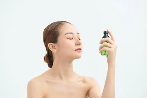 Beautiful asian woman applying spray water on face isolated white background. xkwx spaying, care, fresh, healthy, face, water, portrait, health, spray, thermal, white, beautiful, freshness, bottle, skin, young, beauty, woman, background, applying, treatment, person, closeup, girl, spa, natural, product, model, asian, vietnamese, korean, japanese, chinese