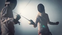 4K Footage of two fencing athletes battle . Professional Fencers competition .