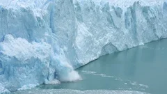 Ice Collapse From Glacier Into Lake. Climate Change and Global Warming