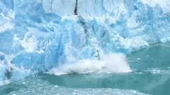 Glacier Ice Collapse Into Ocean Water, Close Up. Global Warming and