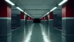 Walking through an empty underground parking garage.