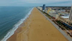 Drone, Aerial flyover of beach and boardwalk on overcast day in Virginia