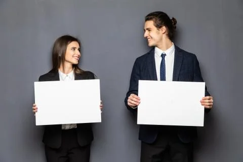 Confident business couple standing with blank board to advertise or invite on gray background xkwx background, woman, business, hand, love, person, girl, couple, man, school, banner, paper, young, isolated, space, happy, blank, showing, board, female, male, casual, studio, smile, presentation, white, billboard, guy, job, feeling, portrait, work, copy, together, posing, surprised, product, caucasian, camera, boyfriend, relationship, romantic, expression, presenting, adult, gesture, two, people, message, invitation