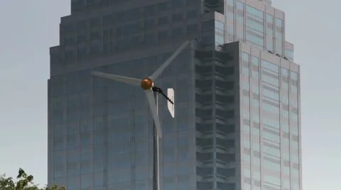 127 Windmill against skyscraper Video stock 21412113