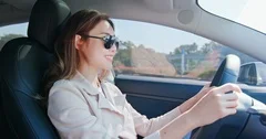 Asian Woman Driving Car